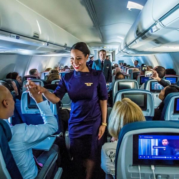 delta flight attendant in aisle